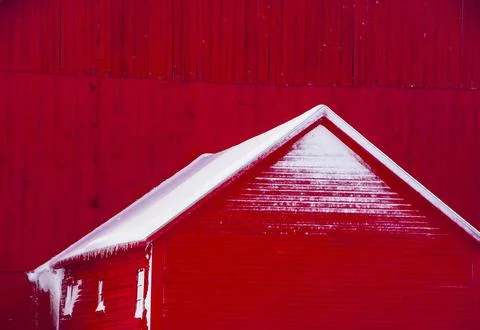 Snow on red barn. Stock Photos