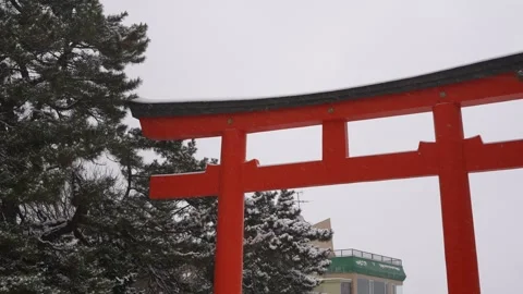 Snow on red gate Close-up shot in Hakodate Gokoku Shrine Hakodate Japan 動画素材 325632139