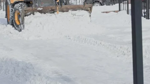 Snow Removal Loader Opening Access Through Residential Yard Stock Footage 347884699
