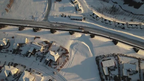 Snow Removal Machine Moving Through a Residential Area in Akureyri Iceland Stock Footage 221854919