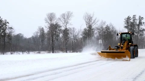 Snow removal machine snowplow clearing a street during a Minnesota storm. Stock Footage 170919058