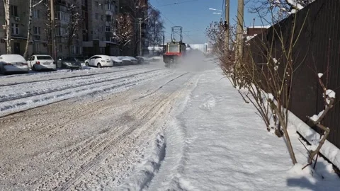 Snow removal by snow plow machine, slow motion close up. Stock Footage 302291024