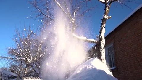 Snow removal in a snowy Stock Footage 327387786