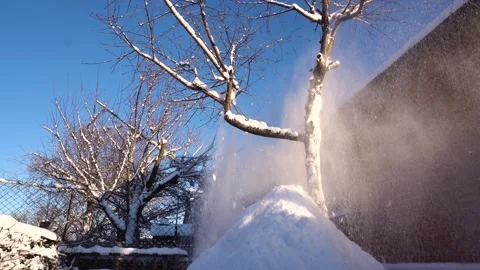 Snow removal in a snowy Stock Footage 327387792