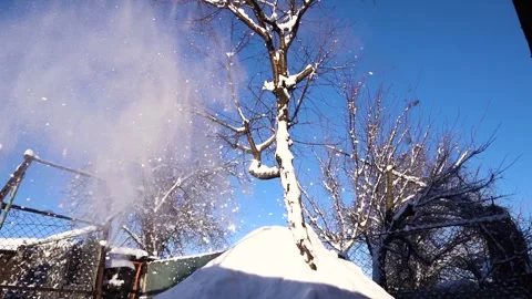 Snow removal in a snowy Stock Footage 327387892
