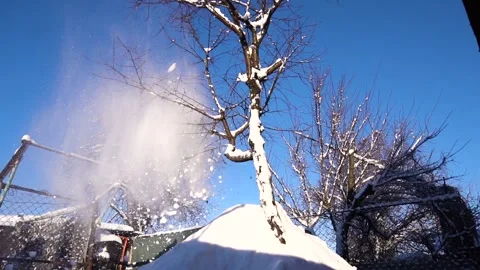 Snow removal in a snowy Stock Footage 327388199
