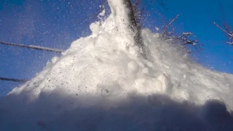 Snow removal in a snowy Stock Footage 327388499
