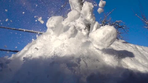 Snow removal in a snowy Stock Footage 327388553