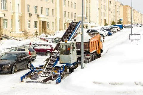 Snow removal from the streets using snow removal equipment and snow removal b Stock Photos