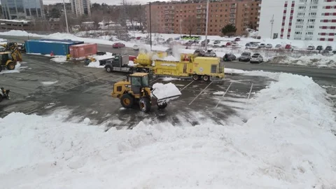 Snow removal using heavy equipment in Halifax, Canada. Stock Footage 271658821