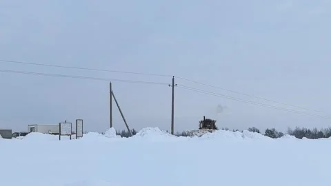 Snow removal work in rural area during winter months with heavy snowfall and low Stock Footage 327101378