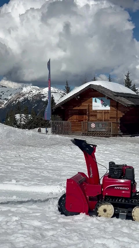 Snow removing machine by winter on the snowcapped slopes Stock Footage 337098792