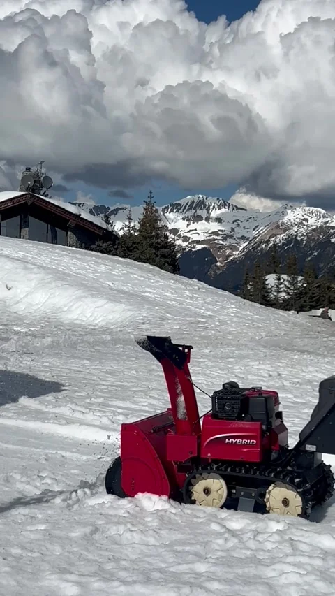 Snow removing machine by winter on the snowcapped slopes Stock Footage 337098896