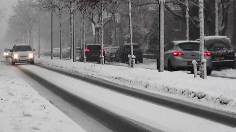 Snow on the road in town.  (audio) Stock Footage 83829301