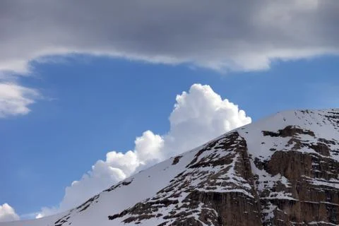 Snow rocks and clouds Stock Photos