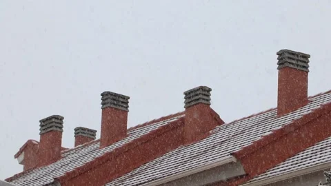 Snow on roofs and 4 chimneys Stock Footage 147457765