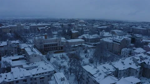 Snow roofs of buildings in the center of Sofia with dark clouds 스톡 동영상 147945736
