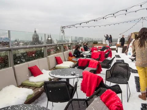 In the snow on a rooftop restaurant Stock Photos