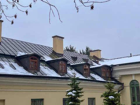 Snow on rooftops during winter in a quiet neighborhood in a city Stock Photos