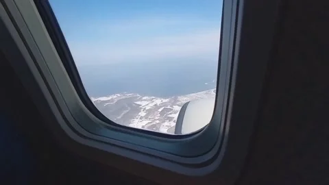 Snow scene seen from the window of an airplane, over Hokkaido Video stock 325642979