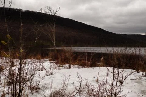 Snow on shore Stock Photos
