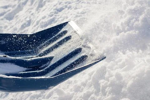 Snow shovel while cleaning Stock Photos