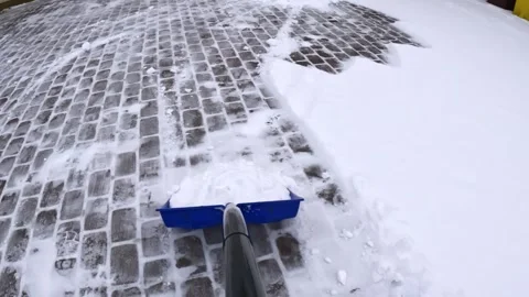 Snow Shoveling POV: Clearing a Path on a Cold Winter Day Stock Footage 327554217