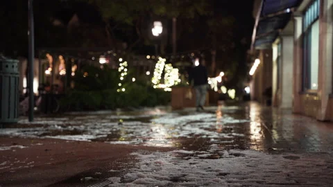 Snow on the sidewalk on statestreet shallow depth of field with pedestrian w Stock Footage 150152430