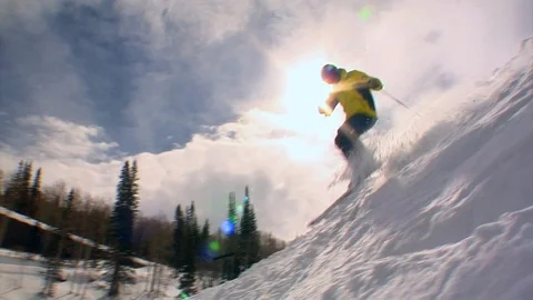 Snow skier down slope with sun flare in background, Utah. Stock Footage 99350758