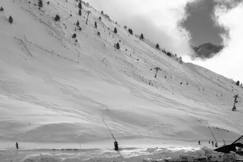 Snow, sky traces, empty slopes and clouds Stock Photos