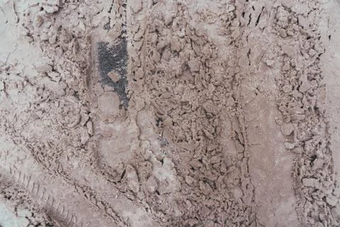 Snow starting to fall i bits as it melts on top of a asphalted road, seen fro Foto stock