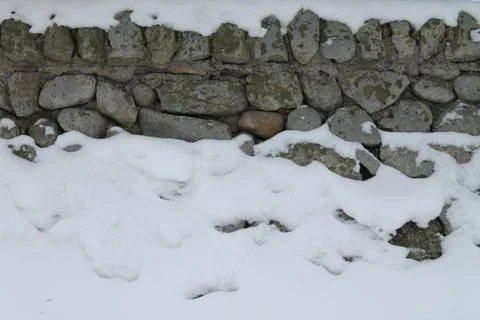 Snow Stone Wall Stock Photos
