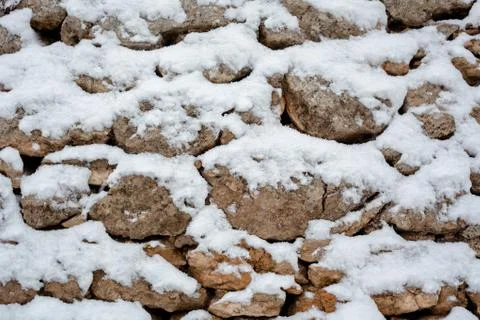 Snow on Stone Wall Stock Photos