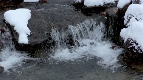 Snow on the stones in the stream Stock Footage 145236786