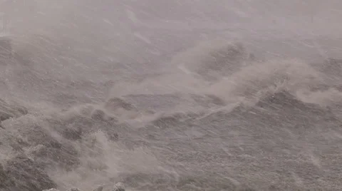 Snow storm blizzard and huge waves crashing and breaking at seawall Stock Footage 46228645
