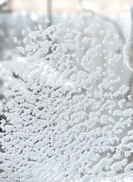 Snow stuck on the window. Winter view. Snowfall. Cold season. Stock Photos