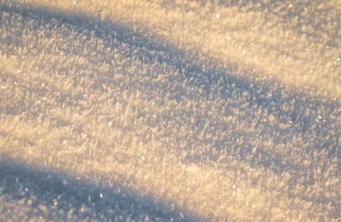 Snow with sunlight and shadows Stock Photos