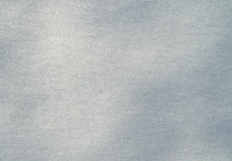 Snow surface pattern. Frosty winter texture background. Frozen snowy field Stock Photos