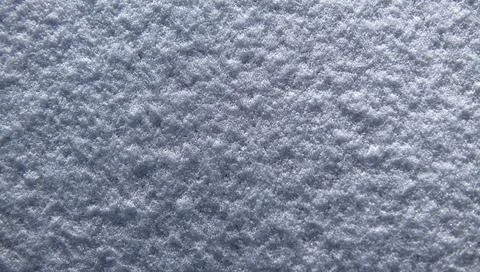 Snow surface with rough texture. Snow background in white pattern. Frozen snow Stock Photos