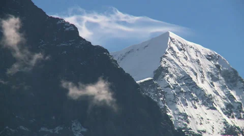 Snow Swirling off a Mountain Video stock 36053133