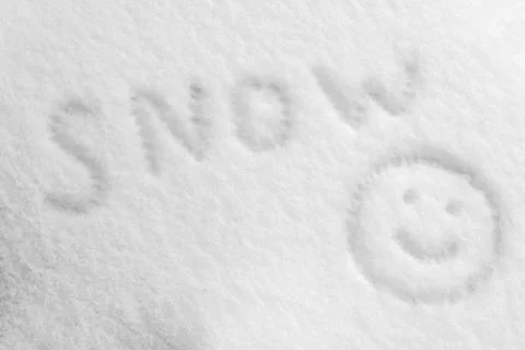 Snow texture is drawn with a smiley face and the inscription snow Stock Photos
