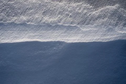 Snow texture, pattern. Light and shadow. Stock Photos