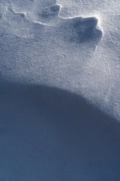 Snow texture, pattern. Light and shadow. Stock Photos