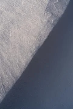 Snow texture, pattern. Light and shadow. Stock Photos