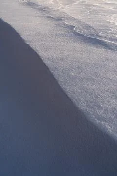 Snow texture, pattern. Light and shadow. Stock Photos