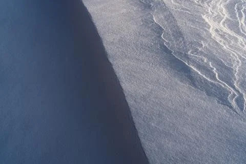 Snow texture, pattern. Light and shadow. Stock Photos