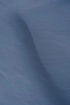 Snow texture, pattern. Light and shadow. Stock Photos