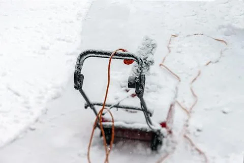 Snow thrower under a snowfall 写真素材