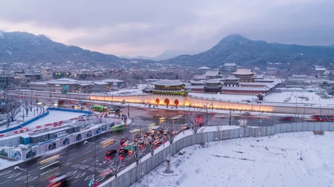 Snow time In the evening, with the road traffic in front of Gyeongbokgung Palace Stock Footage 168068130