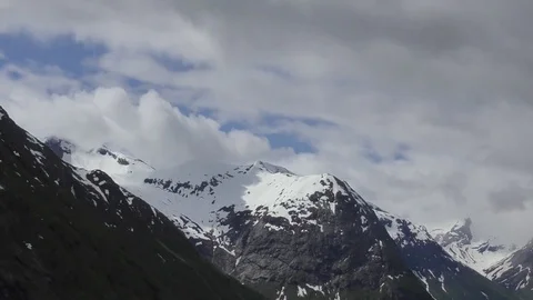 Snow topped mountains moving cloud Stock Footage 77275857